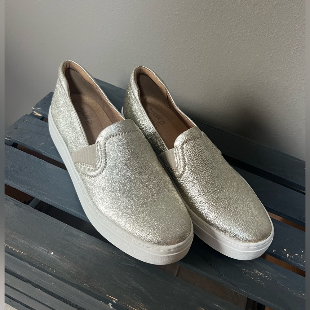 Women’s gold slip on shoes